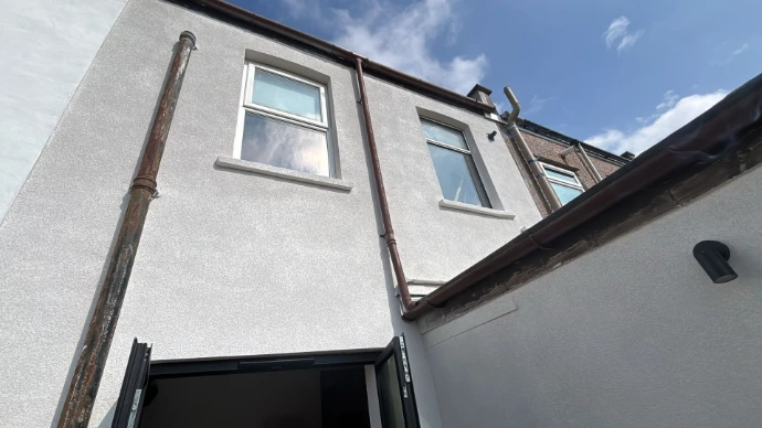 Isolocork spray cork applied to lime render in Bristol